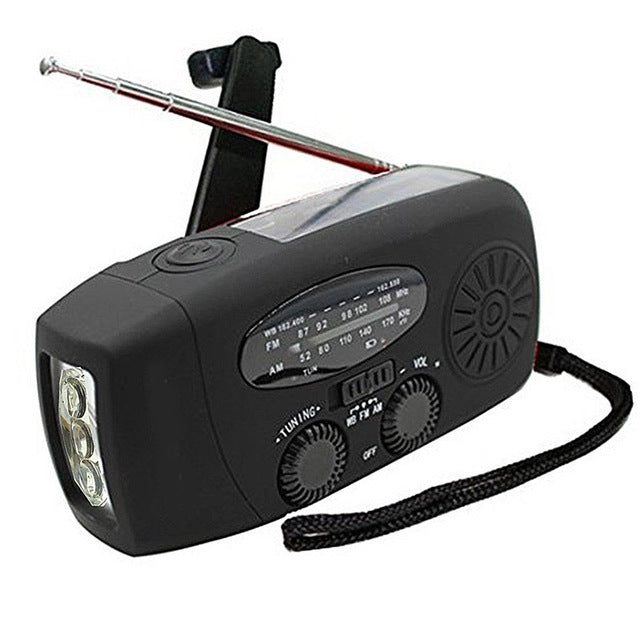 Multifunctional emergency radio with solar power, hand crank, USB port, LED flashlight and FM/AM/WB reception. 
